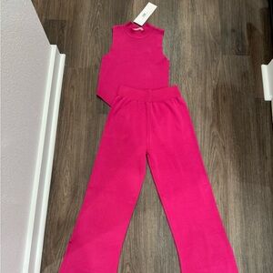 Sleeveless High-Rise Boot Flare Pants in Vibrant Hot Pink sleeveless top.